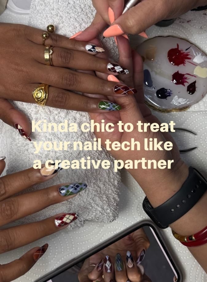 Client and nail technician choosing colours from a palette